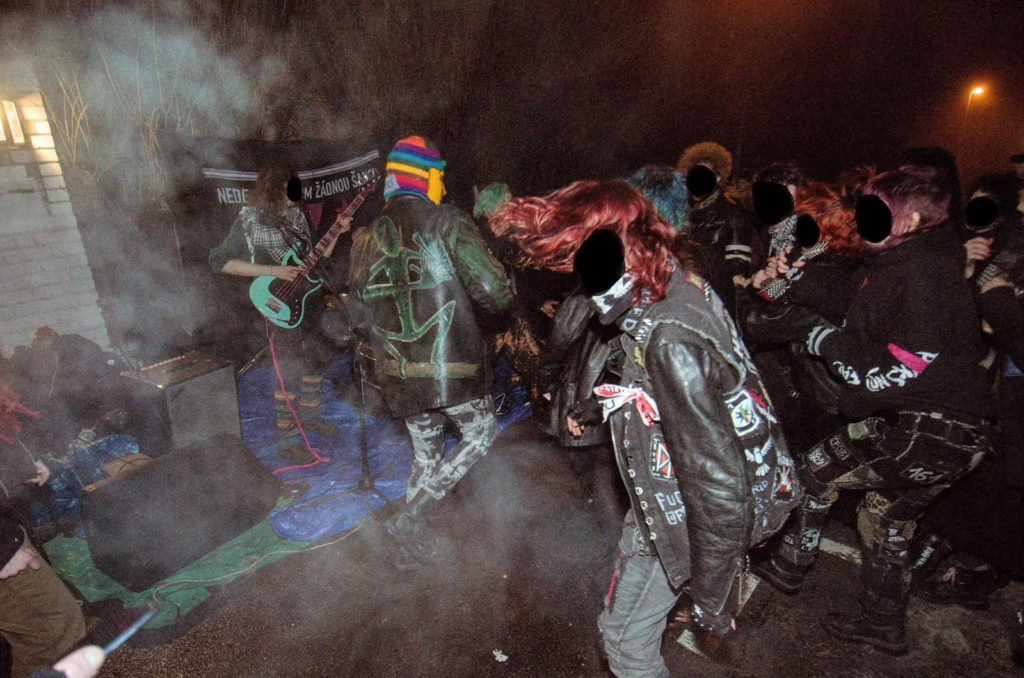 Photo of the mosh pit with the band on the left.